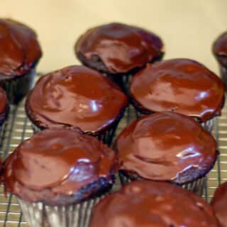Close up photo of glazed Triple Chocolate Cupcakes