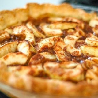 Toffee Apple Pie close up photo of uncut pie.