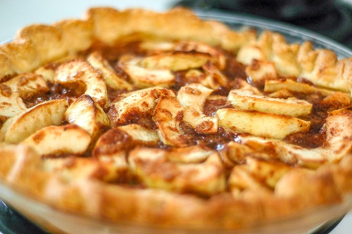 Toffee Apple Pie in a glass pie plate.