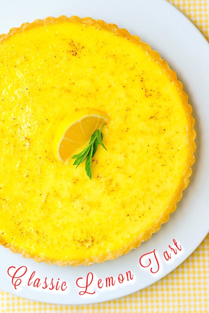 Classic Lemon Tart Photo of uncut tart with title text added for Pinterest