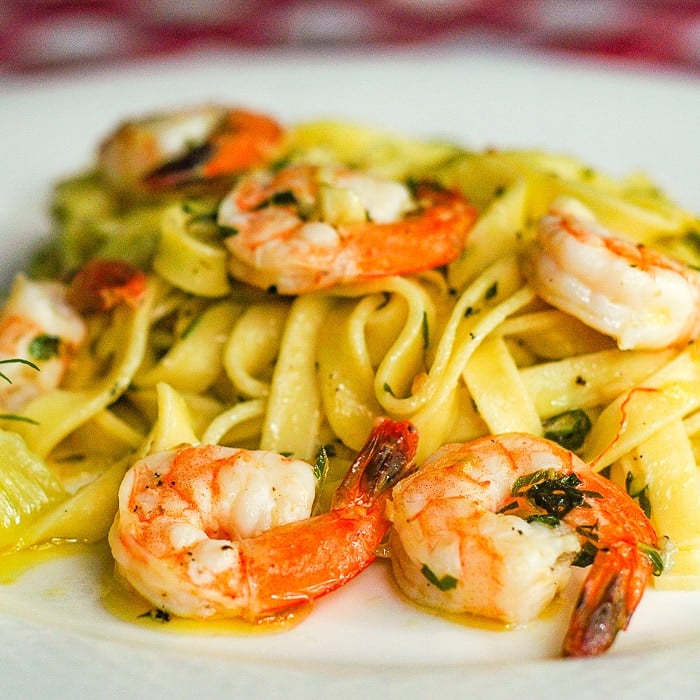 Super Simple Shrimp Scampi close up photo of a single serving on a white plate