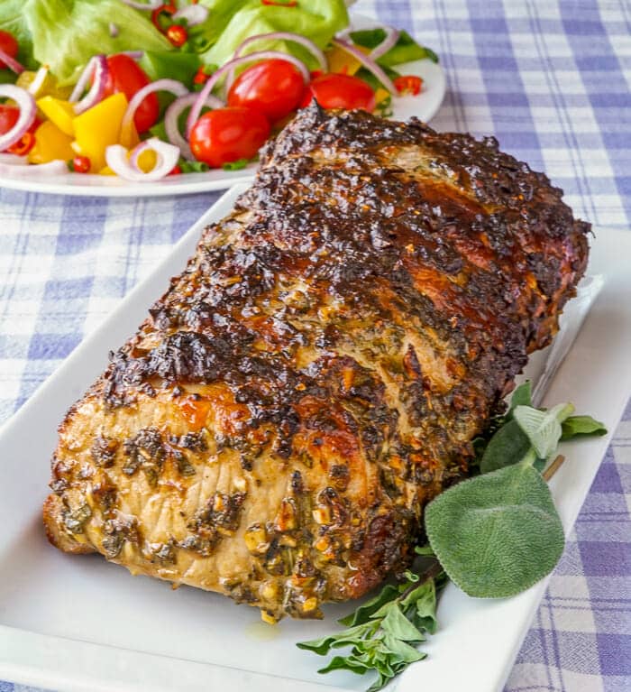 Herb Crusted Pork Loin on serving platter