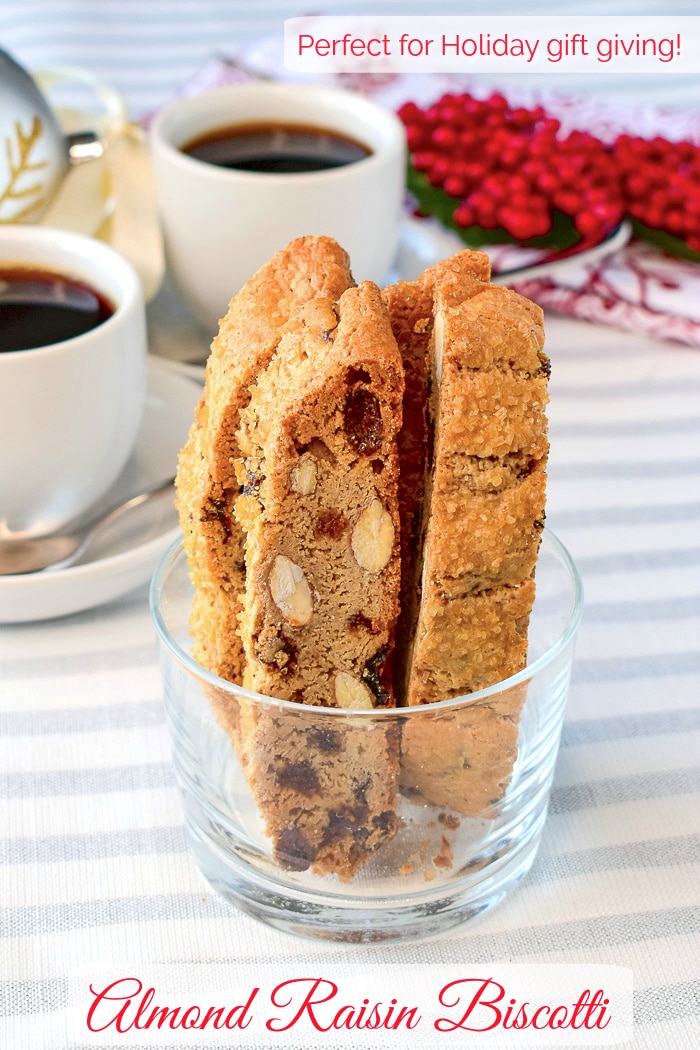 Almond Raisin Biscotti pictured in a clear glass dish with title text added for Pinterest