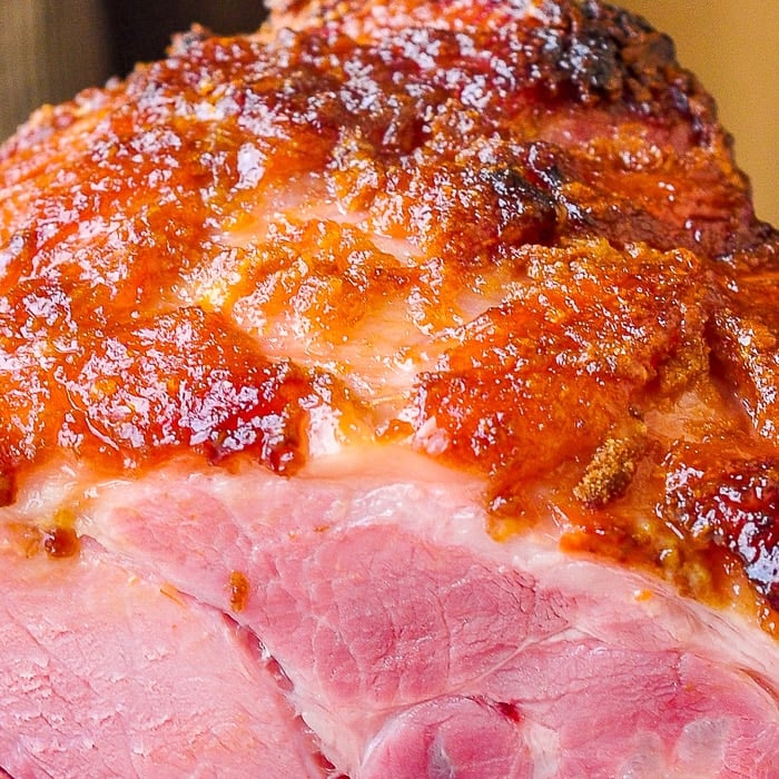 Close up photo of the sticky glaze on a finished baked ham