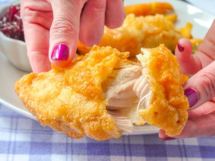 Beer Battered Deep Fried Turkey close up photo showing the crispy batter broken open to show turkey inside