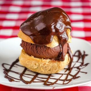 Chocolate Gelato Profiterole Sundaes close up photo of a single sundae on a white plate