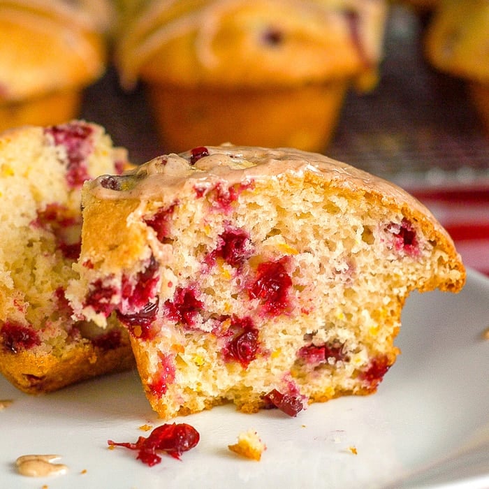 Cranberry Orange Muffins close up showing inside cut of a single muffin