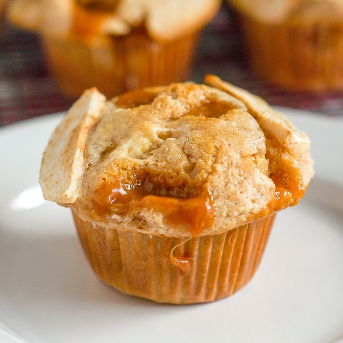 Caramel Apple Muffins close up shot of a single muffin on a white plate