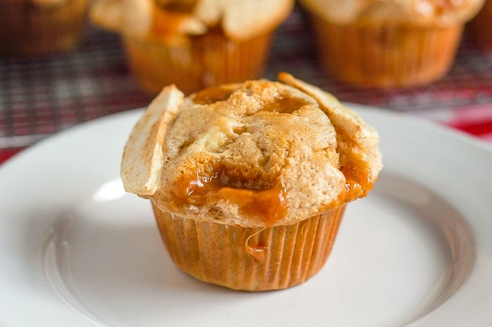 Caramel Apple Muffins wide shot photo on whitepale with mufffins cooling in the background