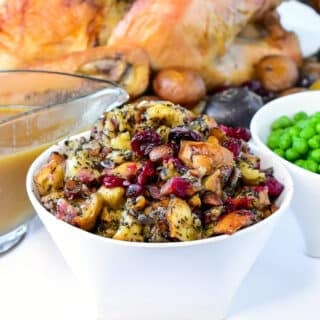 Herb Cranberry stuffing in a white serving bowlHerb Cranverry stuffing in a white serving bowl