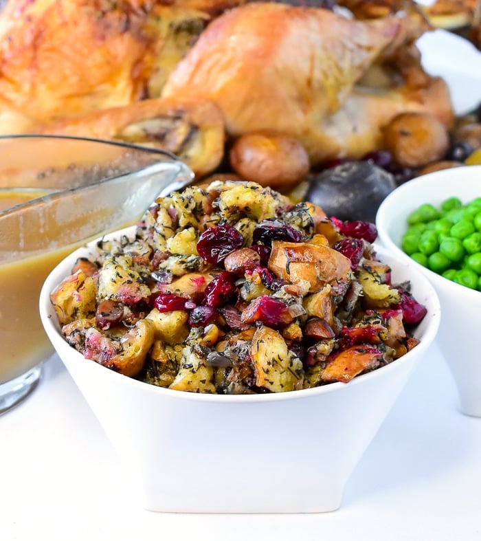 Herb Cranberry stuffing in a white serving bowlHerb Cranverry stuffing in a white serving bowl