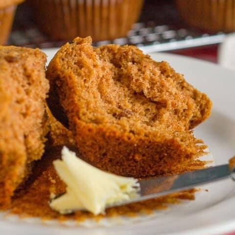 Sweet Potato Spice Muffins split open with butter