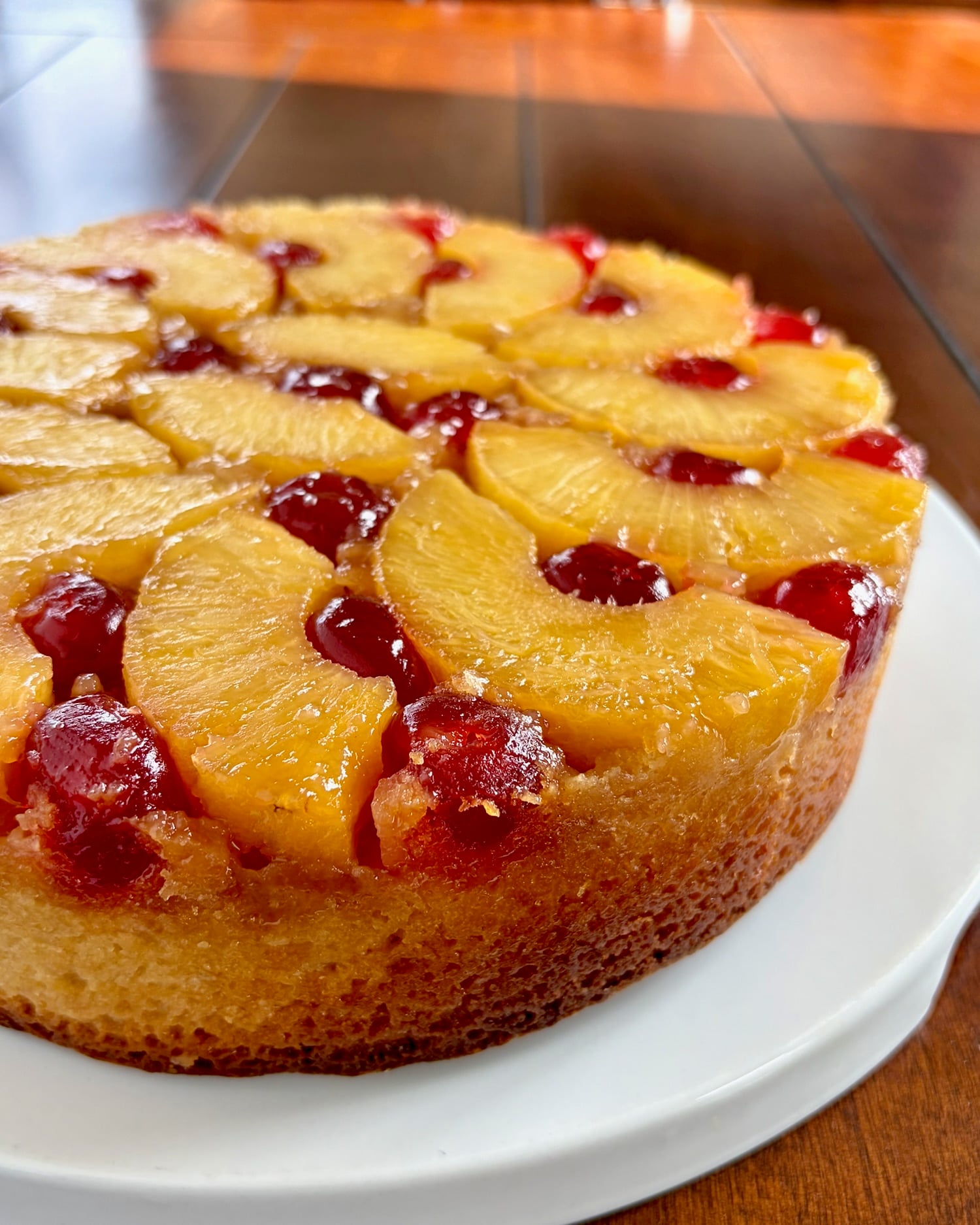 side view photo of t of baked completed Pineapple Upside Down Cake.