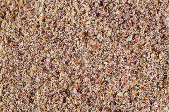 Close up of coarsely ground flax seed for Cranberry Flax Muffins