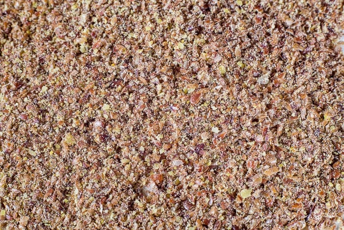 Close up of coarsely ground flax seed for Cranberry Flax Muffins