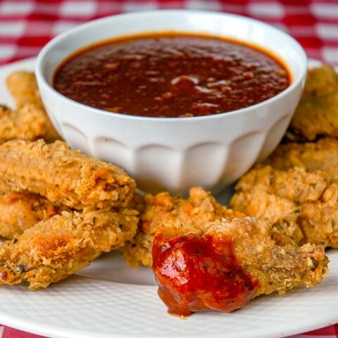 Fried Chicken Wings with Blackstrap Barbecue Sauce, photo shows platter of fried wings with a bowl od BBQ sauce in the centre.