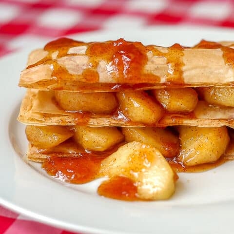 Apple Napoleons close up photo on white plate.