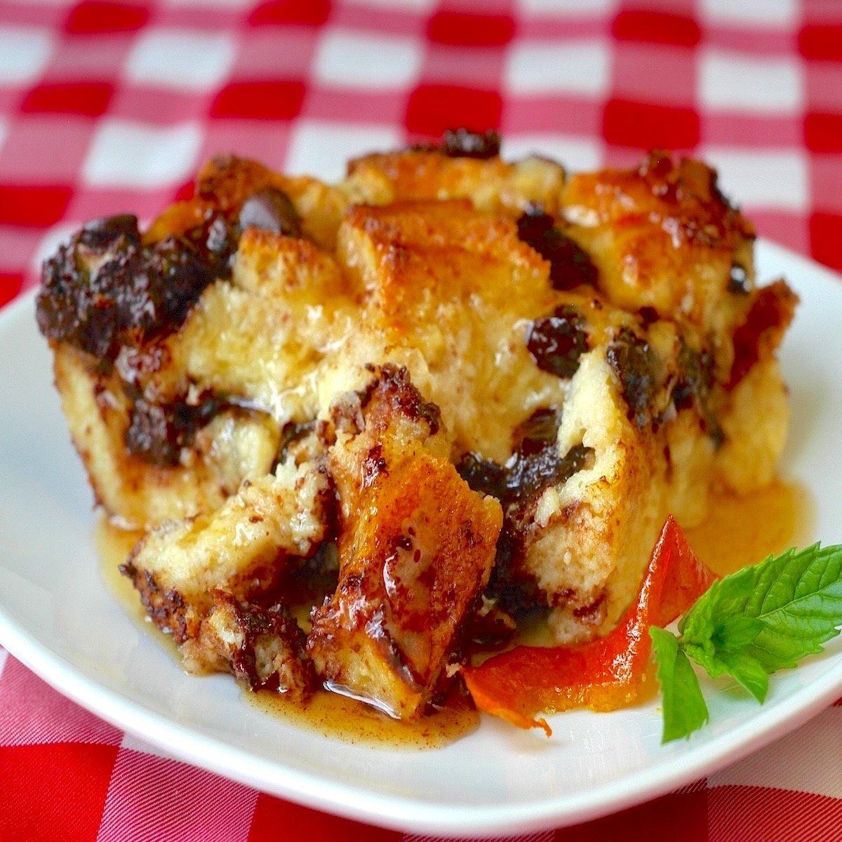 Chocolate Orange Bread pudding photo of a single serving on a white plate