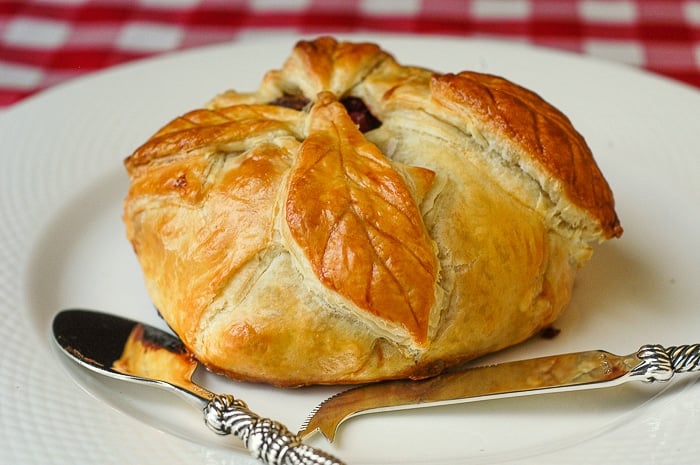 Baked Brie in Puff Pastry with Cranberries Pistachios and Honey.