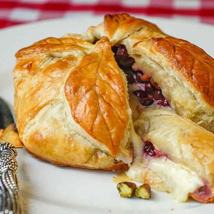 Baked Brie in Puff Pastry with Cranberries Pistachios and Honey.