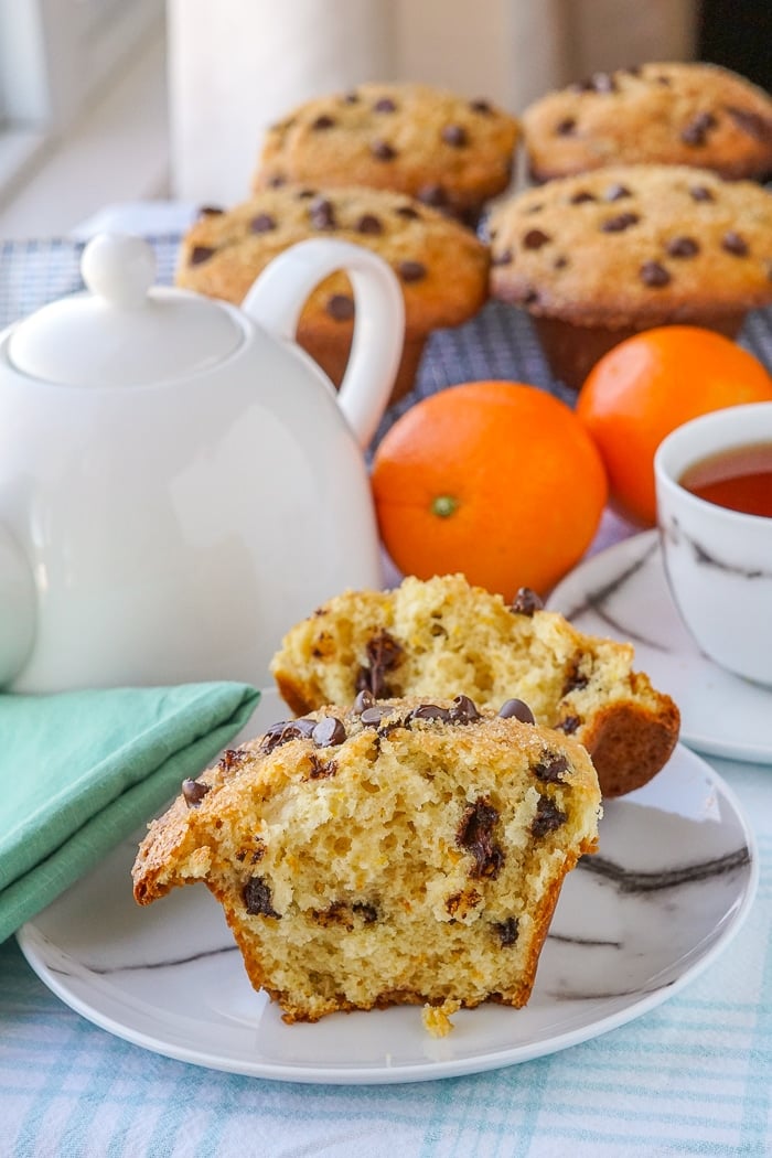 Chocolate Orange Muffins one muffin split open on a marble pattern plate