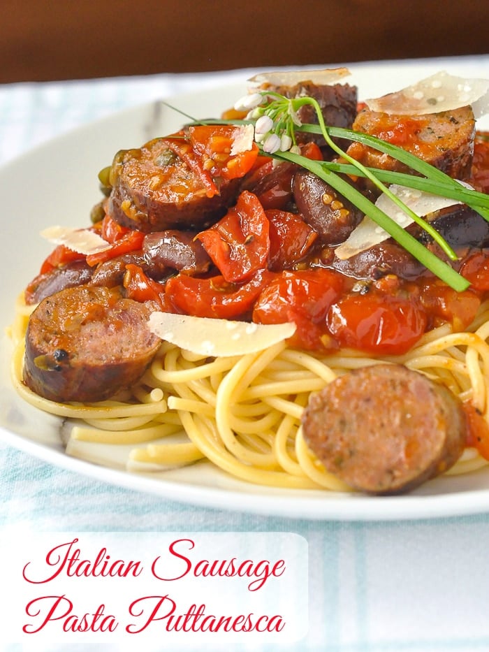 Italian Sausage Pasta Puttanesca photo of a single serving with title text added for Pinterest