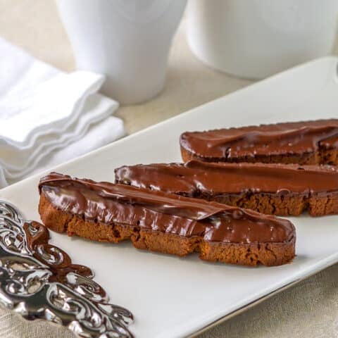 Gingerbread Biscotti close up image on white and silver serving platter