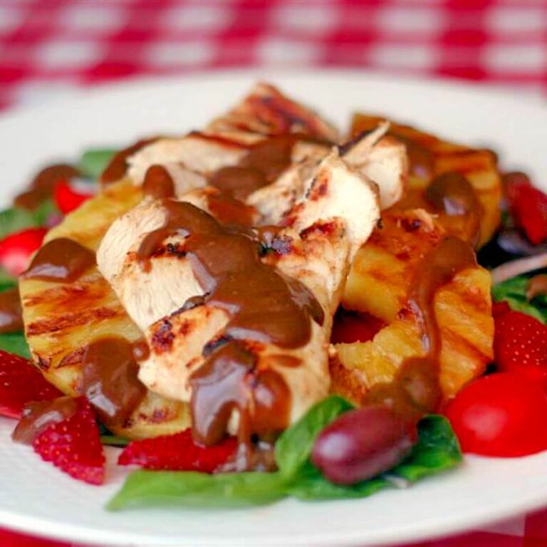 Grilled Pineapple and Chicken Salad photo of a single serving on a white plate