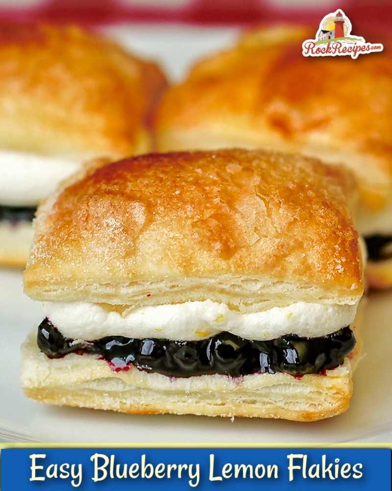 Blueberry Lemon Mini Puff Pastries  aka Flakies close up photo of one pastry with title text added for Pinterest and social media.