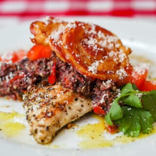 Garlic Oregano Chicken with Red Pepper Parmesan Tapenade and Crispy Pancetta, close up photo