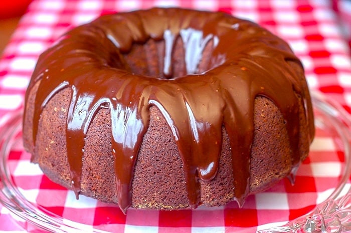 Ginger Bundt Cake wide shot photo of entire cake on clear glass plate