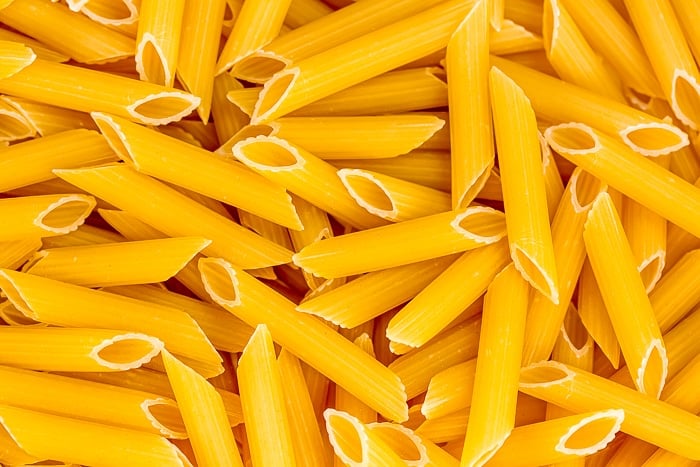 Close up of uncooked penne pasta