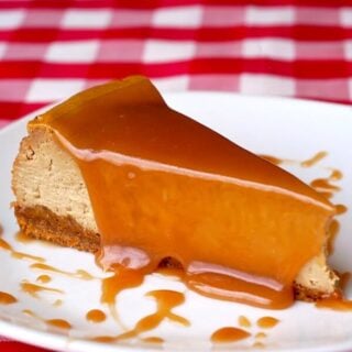 Café au Lait Cheesecake photo of a single slice on a white plate.