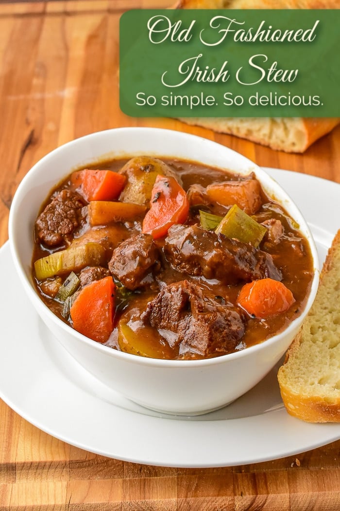 Irish Stew shown with sourdough bread and title text added for Pinterest