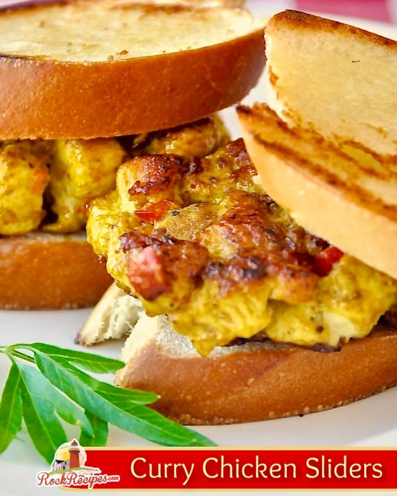Curry Chicken Sliders, Close up photo of 2 sliders with title text added for social media posts.