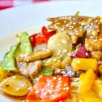 Easy Stir Fried Pineapple Pork featured square image on white plate served with noodles