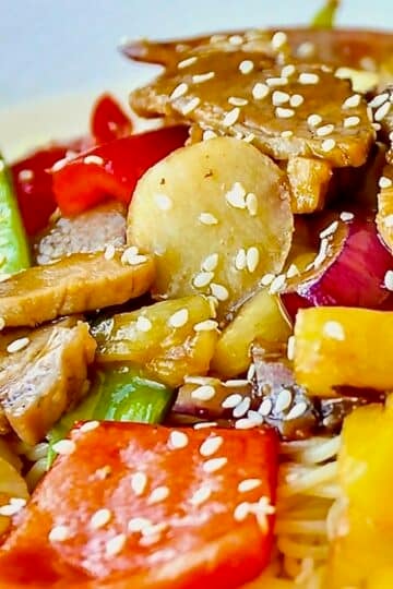 close up pohoto. Easy Stir Fried Pineapple Pork featured square image on white plate served with noodles