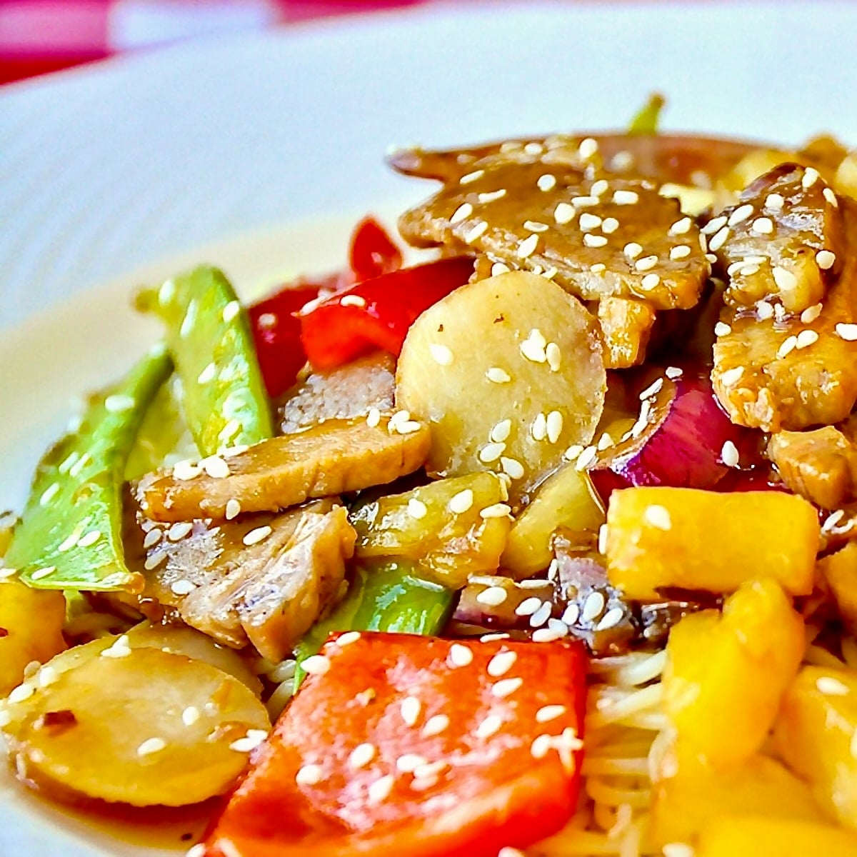 Easy Stir Fried Pineapple Pork featured square image on white plate served with noodles