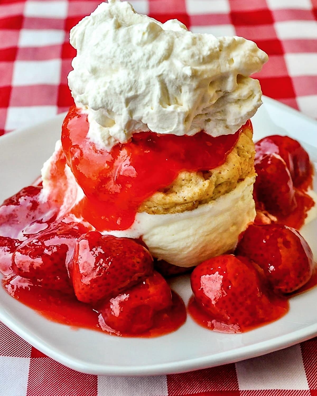 Strawberry Shortcake Sundaes close up photo of one serving on a white square plate