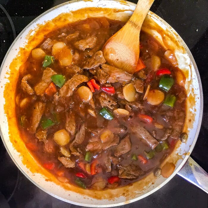 Orange Beef with Cashews ready to add the orange segments and serve.