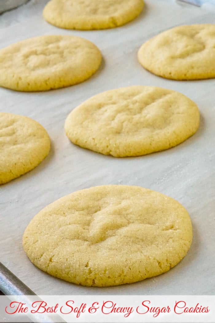 Photo of Soft and Chewy Sugar Cookies fresh from the oven with title text added for Pinterest