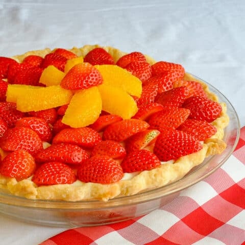 White Chocolate Mousse Pie with Orange and Strawberry close up photo of uncut pie