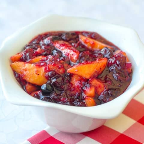 Cranberry Peach Chutney in a white serving bowl