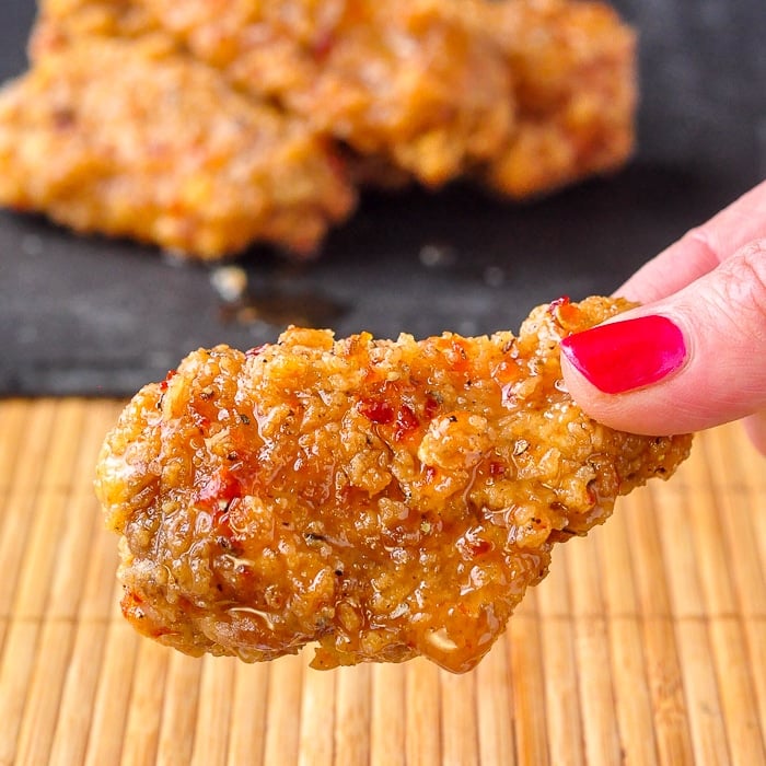 Crispy Sweet Spicy Sticky Wings close up image of a single wing