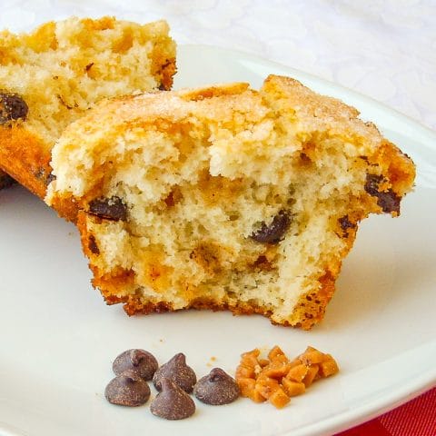 Toffee Chocolate Chip Muffins photo of one muffin split open on a white plate