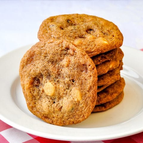 Toffee Coffee Chocolate Chip Cookies stacked on a white plate