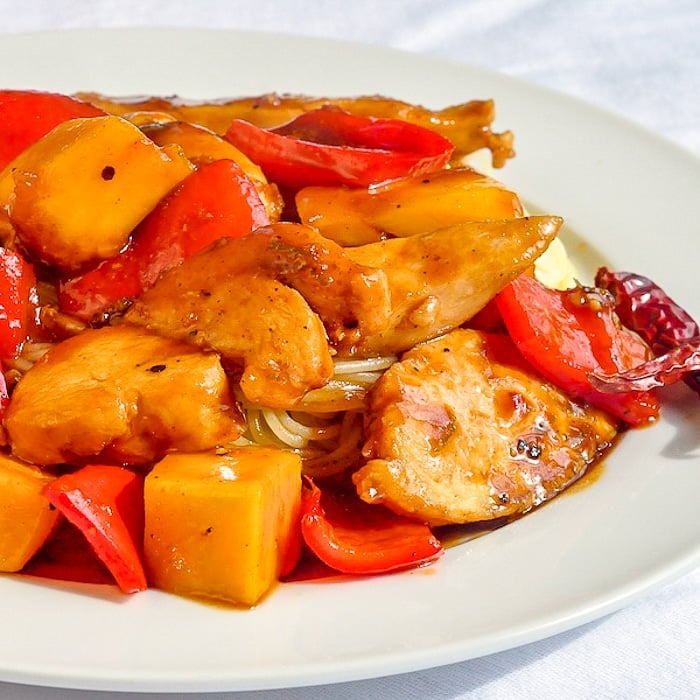 Quick and Easy Mango Chicken close up photo on white plate