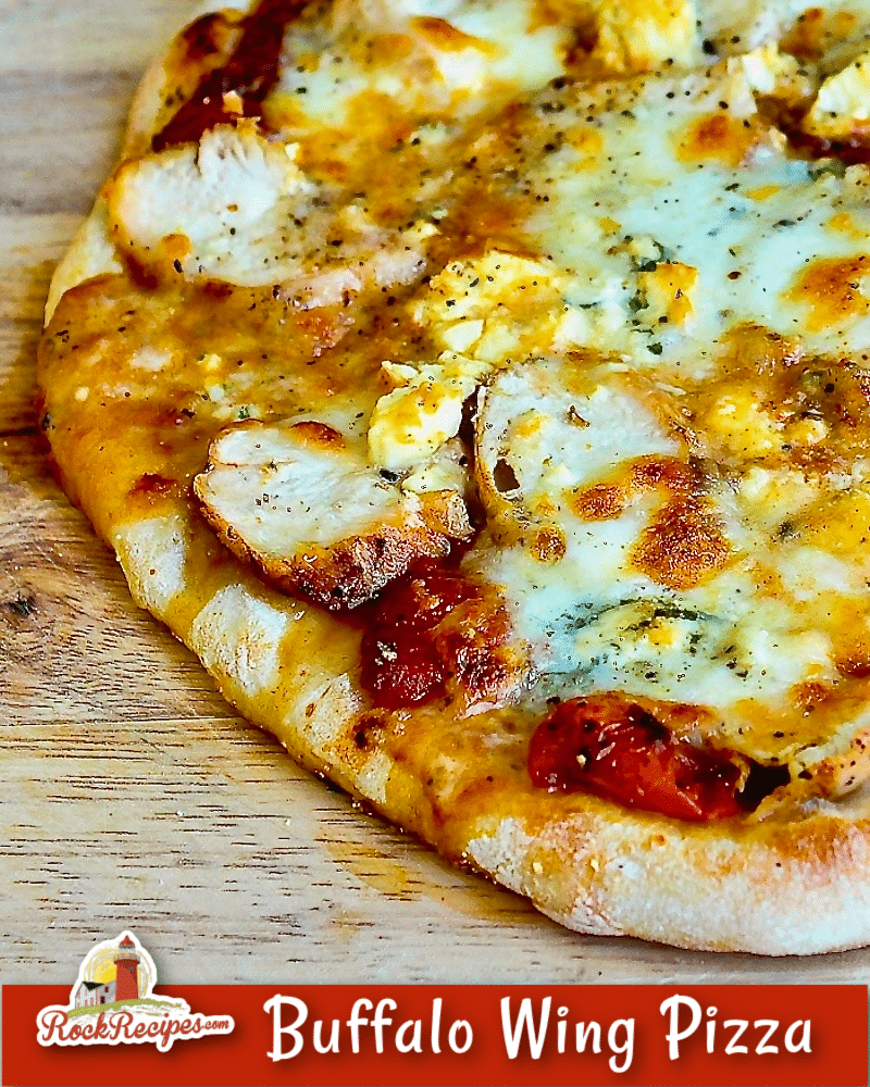 Buffalo Wing Pizza close up photo on a wooden cutting board with title text added for social media posts.