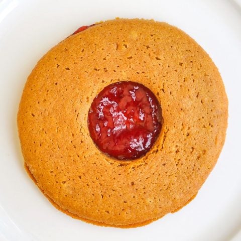 Jam Jams close up photo of single cookie on a white plate