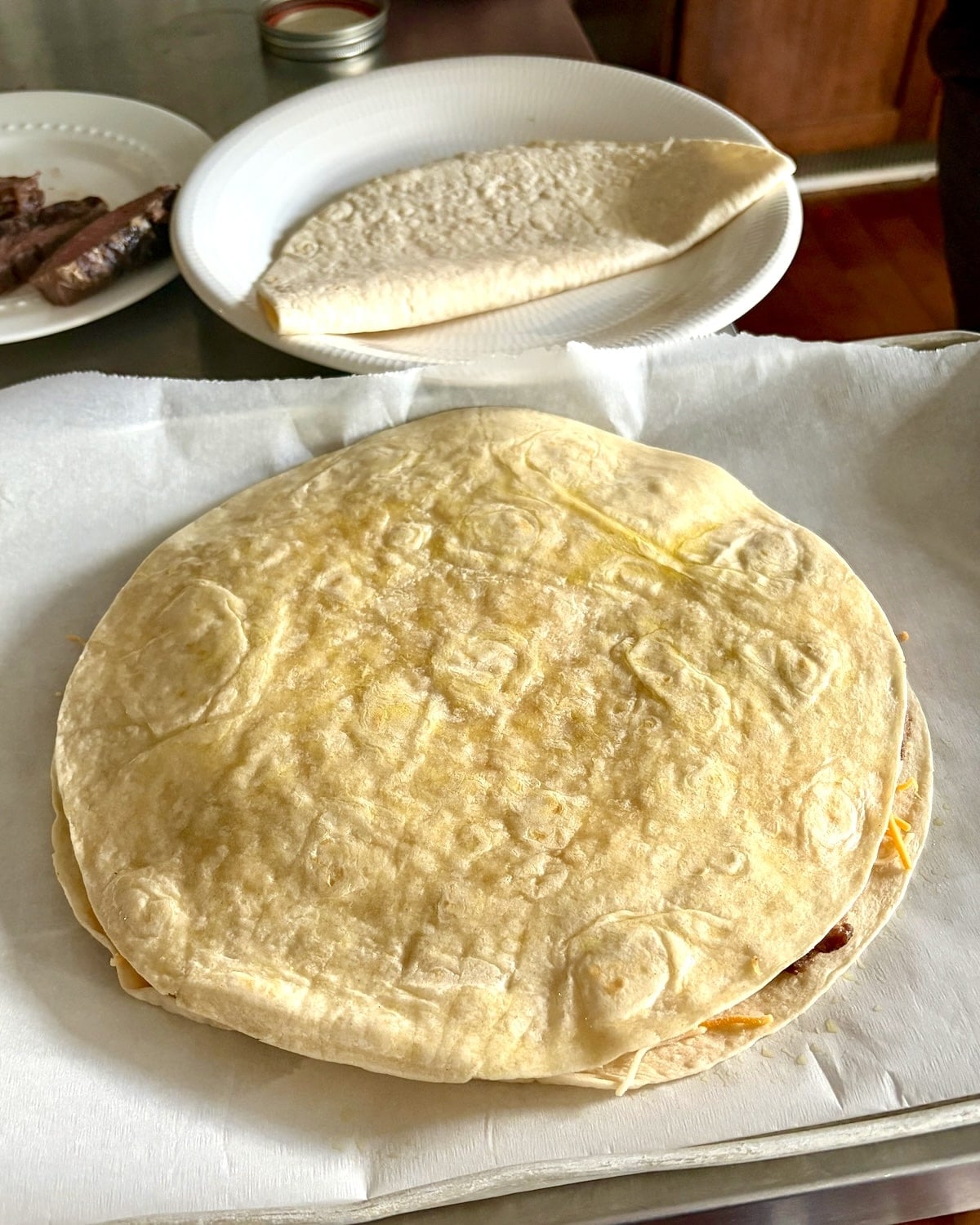Add second tortilla on top.